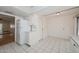 Bright kitchen with white cabinetry, tile floors, and modern appliances at 18034 N Highwood Ct, Sun City, AZ 85373