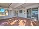 Cozy sunroom with white brick and tile flooring at 18034 N Highwood Ct, Sun City, AZ 85373