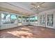 Bright sunroom featuring brick accents, tile flooring, and lots of natural light at 18034 N Highwood Ct, Sun City, AZ 85373