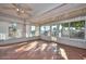 Bright sunroom featuring white brick and tiled floor at 18034 N Highwood Ct, Sun City, AZ 85373