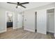 Bedroom with ceiling fan, closet, and ensuite bathroom access at 1913 E 1St Ave, Mesa, AZ 85204