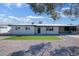 Charming single-story home with low maintenance rock landscaping, artificial grass, and covered parking at 1913 E 1St Ave, Mesa, AZ 85204