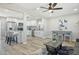 Open-concept living area flowing into a modern kitchen, featuring beautiful wood floors at 1913 E 1St Ave, Mesa, AZ 85204