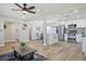 Open-concept living area flowing into a modern kitchen, featuring beautiful wood floors at 1913 E 1St Ave, Mesa, AZ 85204