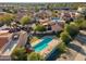 Wonderful aerial view of townhomes, pool, and parking with attractive southwestern landscaping and architecture at 1920 E Maryland Ave # 16, Phoenix, AZ 85016