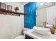 Stylish bathroom with a modern vessel sink, vanity and a decorative blue accent wall creating a spa-like retreat at 1920 E Maryland Ave # 16, Phoenix, AZ 85016