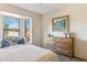 Bedroom with window seat and decorative pillows; dresser has rustic hardware at 1920 E Maryland Ave # 16, Phoenix, AZ 85016