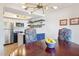 Bright dining room with a modern chandelier and open views into a stylish, updated kitchen at 1920 E Maryland Ave # 16, Phoenix, AZ 85016