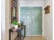 Home entryway showcasing a decorated console table, patterned tile flooring, and a decorative mirror at 1920 E Maryland Ave # 16, Phoenix, AZ 85016