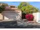 Charming home featuring an attached garage, mature landscaping, and a welcoming desert aesthetic at 1920 E Maryland Ave # 16, Phoenix, AZ 85016