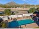 Inviting community pool with pristine water, covered pergola, and views of Mummy Mountain at 1920 E Maryland Ave # 16, Phoenix, AZ 85016