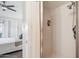 Bathroom with a shower stall featuring white tile and built-in shelving at 1920 E Maryland Ave # 16, Phoenix, AZ 85016