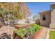 Charming backyard featuring raised garden beds, a pool with lounge chairs, and lush landscaping for relaxation at 22970 N 79Th Pl, Scottsdale, AZ 85255