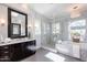 Elegant bathroom with double vanity, soaking tub, and separate glass-enclosed shower at 22970 N 79Th Pl, Scottsdale, AZ 85255