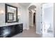 Well-lit bathroom boasts a marble vanity, modern lighting, and entry to toilet area at 22970 N 79Th Pl, Scottsdale, AZ 85255