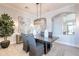 Dining room features designer lighting fixture, neutral walls, and arched entryways at 22970 N 79Th Pl, Scottsdale, AZ 85255