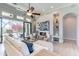 Spacious living room with fireplace and sliding glass doors at 22970 N 79Th Pl, Scottsdale, AZ 85255