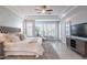 Beautiful primary bedroom features a ceiling fan, shuttered windows, and neutral tones at 22970 N 79Th Pl, Scottsdale, AZ 85255