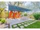 A lovely outdoor kitchen features a built-in grill and counterspace with an elegant awning at 22970 N 79Th Pl, Scottsdale, AZ 85255