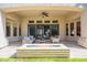 Comfortable outdoor patio with a stone fireplace and plenty of seating at 22970 N 79Th Pl, Scottsdale, AZ 85255