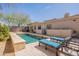 Private backyard pool with lounge chairs and travertine decking, providing a serene and luxurious outdoor retreat at 22970 N 79Th Pl, Scottsdale, AZ 85255