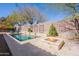 Beautiful backyard with a sparkling pool, a fire pit, and lush landscaping, ideal for outdoor entertaining and relaxation at 22970 N 79Th Pl, Scottsdale, AZ 85255