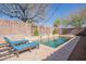 Inviting pool area with lounge chairs, water features, and ambient lighting, perfect for relaxation and entertaining at 22970 N 79Th Pl, Scottsdale, AZ 85255