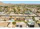 Panoramic aerial perspective of a neighborhood with an open desert space providing a natural backdrop at 2349 E Sahuaro Dr, Phoenix, AZ 85028