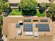 Aerial view of a home's roof with solar panels, surrounded by lush greenery at 2349 E Sahuaro Dr, Phoenix, AZ 85028