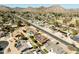 A neighborhood view from above, displaying varied rooflines, desert landscaping, and mountain backdrops at 2349 E Sahuaro Dr, Phoenix, AZ 85028