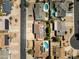 A detailed aerial view shows a neighborhood's layout, highlighting pools and solar panels on various rooftops at 2349 E Sahuaro Dr, Phoenix, AZ 85028