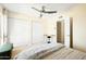 Bedroom featuring a ceiling fan, large closets, and a neutral color palette at 2349 E Sahuaro Dr, Phoenix, AZ 85028