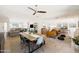 Open dining room with wood table, modern chairs and view into the renovated living area at 2349 E Sahuaro Dr, Phoenix, AZ 85028