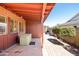 Covered patio area with a hot tub and brick flooring, great for outdoor relaxation at 2349 E Sahuaro Dr, Phoenix, AZ 85028