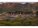 An expansive view of a modern community building set amongst the natural desert landscape at 23750 N 126Th Pl, Scottsdale, AZ 85255