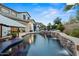 Enjoy the sparkling pool and spa with rock waterfall features in this backyard at 2454 E Ebony Dr, Chandler, AZ 85286