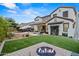 Expansive backyard with artificial turf, fire pit, and luxurious outdoor living space perfect for relaxation at 2454 E Ebony Dr, Chandler, AZ 85286