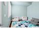 Relaxing bedroom area with blue walls, soft seating, and an abundance of natural light at 2454 E Ebony Dr, Chandler, AZ 85286