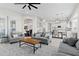 Bright open-concept living room flows into the dining area and kitchen, offering a spacious and inviting atmosphere at 2454 E Ebony Dr, Chandler, AZ 85286