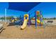 Brightly colored blue and yellow playground structure with slides under a blue awning and sunny sky at 2454 E Ebony Dr, Chandler, AZ 85286