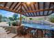 Entertain guests at the poolside bar with a built-in grill and beautiful stone accents at 2454 E Ebony Dr, Chandler, AZ 85286