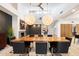 Elegant dining room featuring a fireplace, ample natural light, and contemporary furnishings at 25 W Frier Dr, Phoenix, AZ 85021