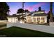 Striking home exterior showcases clean lines, desert landscaping, and a private courtyard under a colorful sky at 25 W Frier Dr, Phoenix, AZ 85021