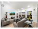 Stylish living room with contemporary sofas, a sleek glass table, and a bright ambiance perfect for relaxation at 25 W Frier Dr, Phoenix, AZ 85021