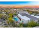 Aerial showcasing the backyard pool and patio of an upscale house at sunset at 25436 N 114Th St, Scottsdale, AZ 85255