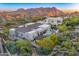 Back of property showcasing the pool and patio area, surrounded by desert landscaping at 25436 N 114Th St, Scottsdale, AZ 85255