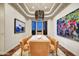 Elegant dining room with modern chandelier and large windows at 25436 N 114Th St, Scottsdale, AZ 85255