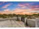 Stairway and gate to the property with a view of desert vegetation and sunset at 25436 N 114Th St, Scottsdale, AZ 85255