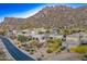 Upscale homes are nestled among desert vegetation, creating a tranquil and luxurious setting at 25436 N 114Th St, Scottsdale, AZ 85255