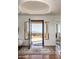 Bright foyer with terra cotta flooring, a decorative rug, and an open doorway with views of the mountains at 25436 N 114Th St, Scottsdale, AZ 85255